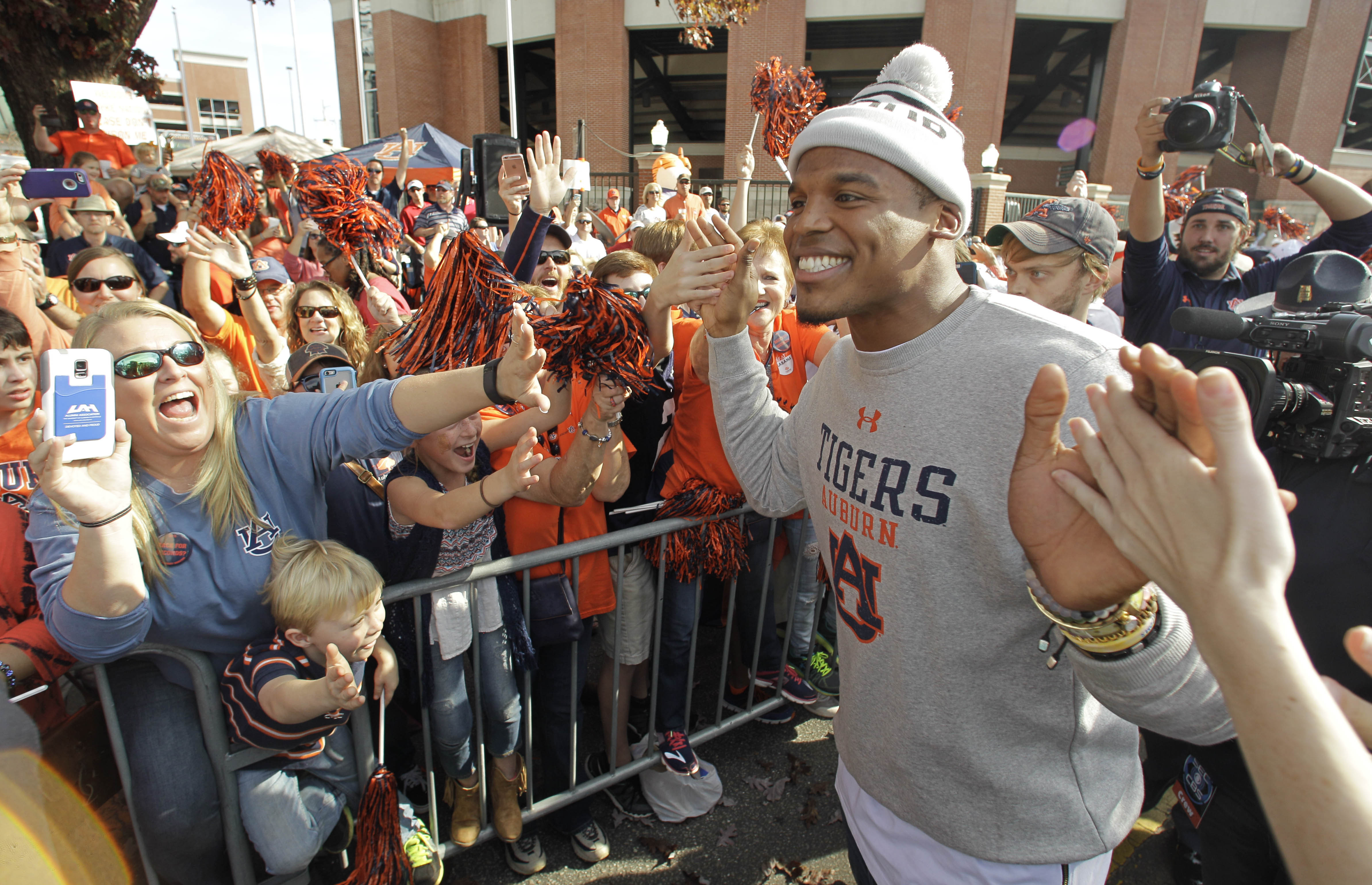 Auburn Tiger Walk: Best Photos From a Rain-Soaked Fan Celebration Before the New Mexico Game