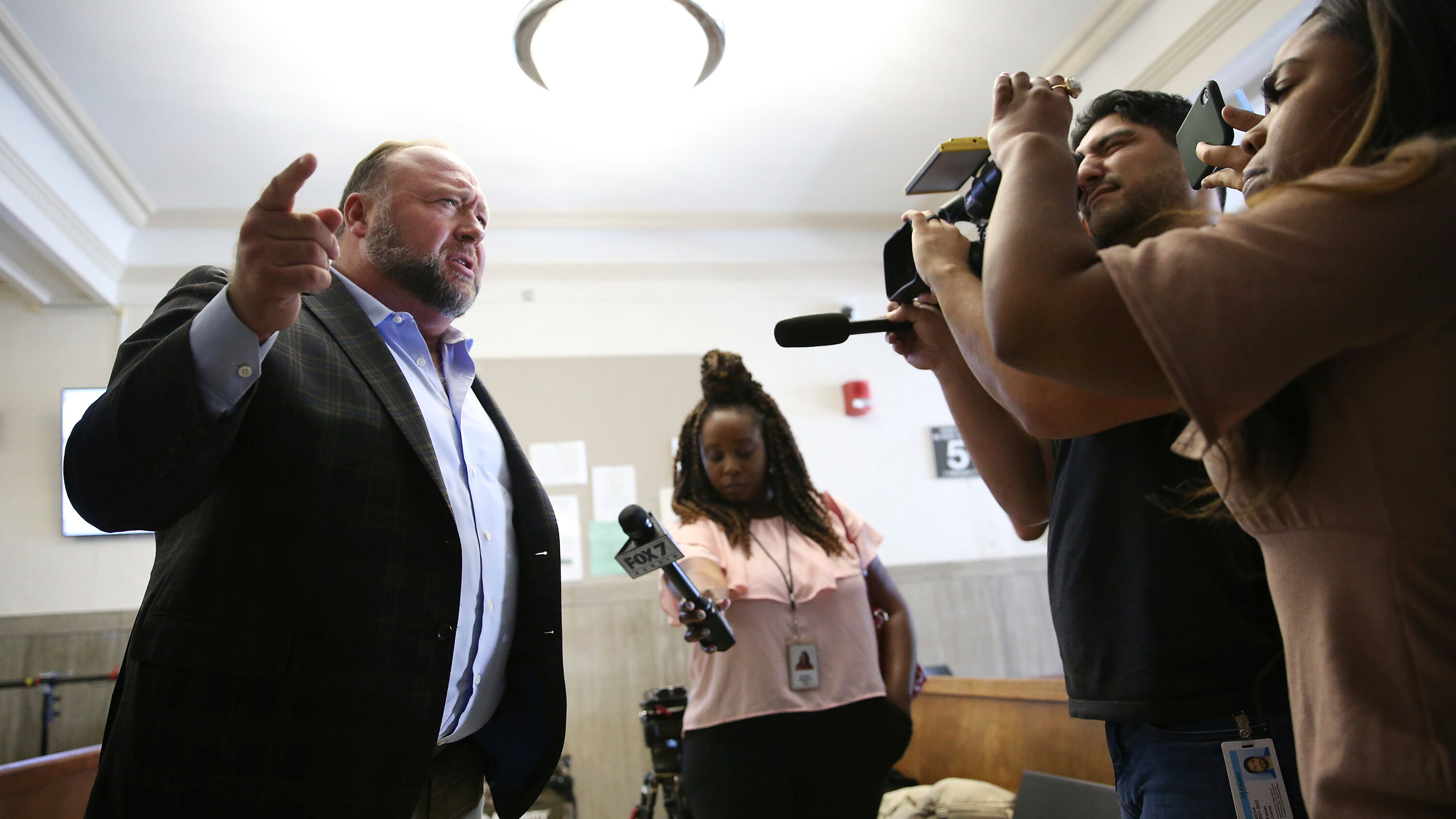 Satirical News Giant The Onion Takes Over Alex Jones' Infowars in Bankruptcy Auction