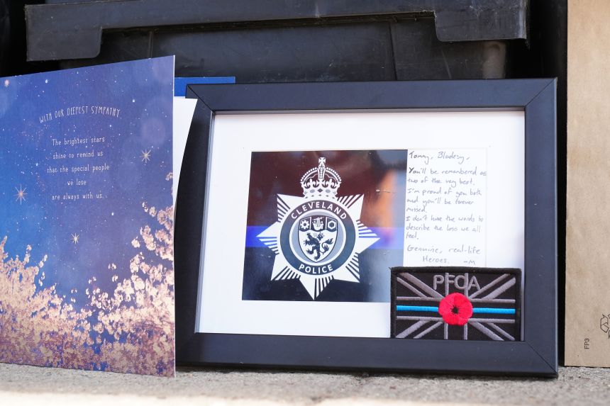More tributes outside the Cleveland Police HQ in Middlesbrough on Monday.