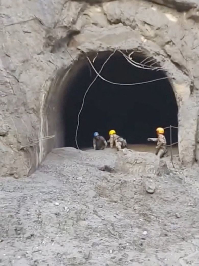 Rescuers evacuate a person from a tunnel of a hydropower project, in the aftermath of flash floods and a mudslide, in Rasuwa, Nepal.