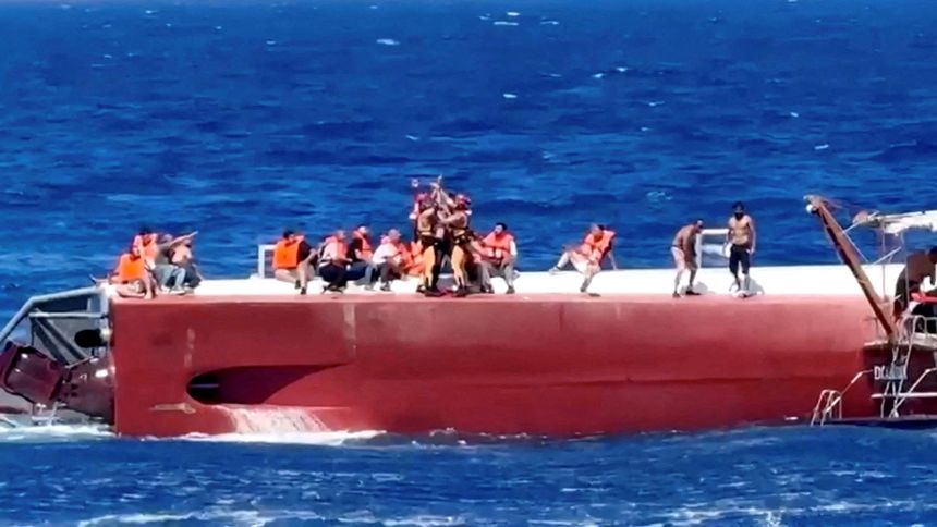 A passenger is rescued off a private ferry that capsized off the coast of Northern Cyprus, August 30, 2026, in this screengrab taken from a video.