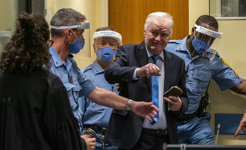 Mladic arrives in the courtroom prior to the hearing of the final verdict on appeal against his genocide conviction over the 1995 Srebrenica massacre, Europe's worst act of bloodshed since World War II, on June 8, 2021 at the International Residual Mechanism for Criminal Tribunals (IRMCT) in The Hague.