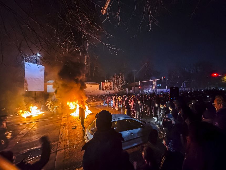 Iranians block a street during a protest in Tehran, Iran on January 9, 2026.